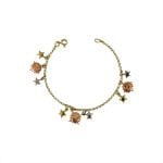 Pulsera de oro amarillo tres colores italiano modelo roló con colgantes de sol y estrellas