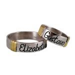 Par de alianzas de plata modelo cinta con aplique en oro y nombres grabados