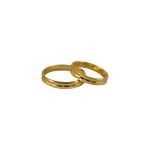 Par de alianzas de oro italiano modelo piaget con detalles marcados