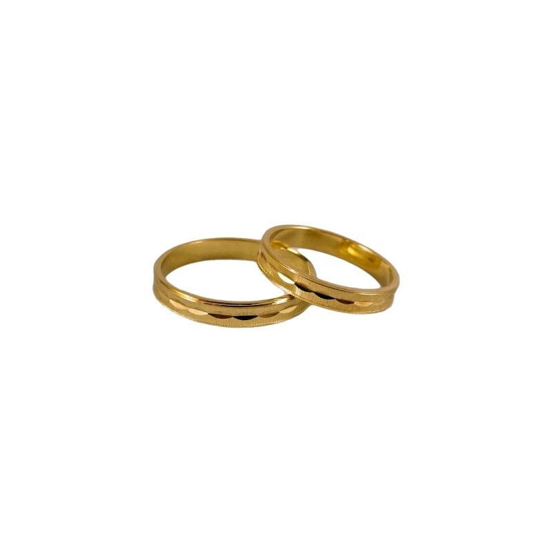 Par de alianzas de oro italiano modelo piaget con detalles marcados