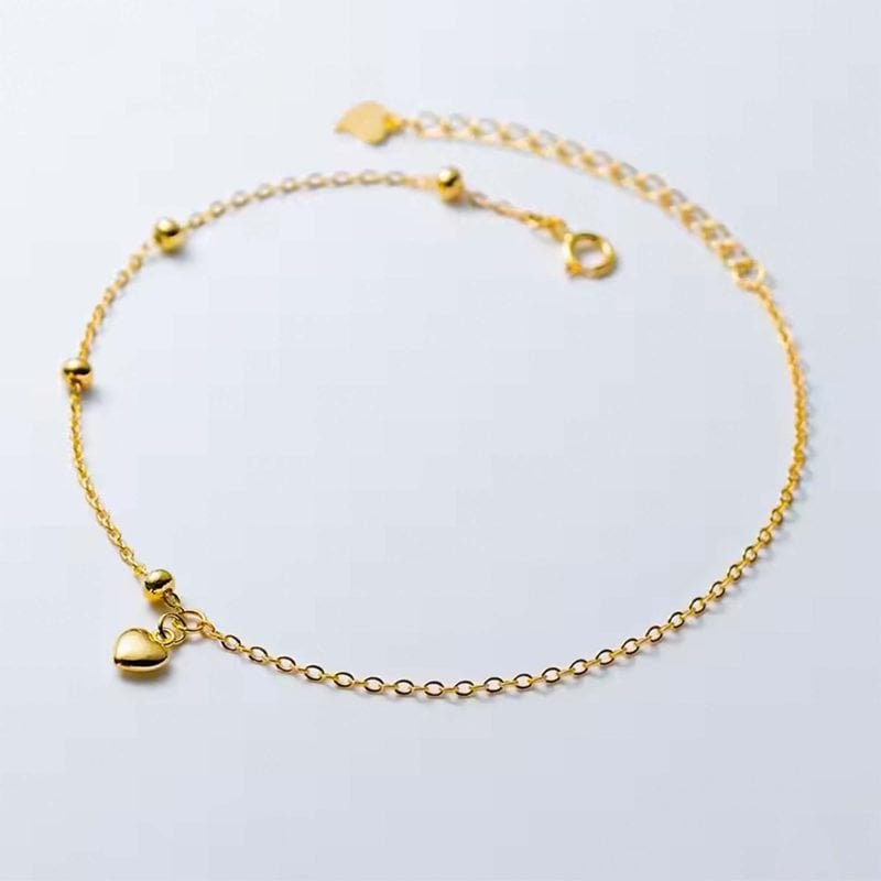 Pulsera de plata italiana con enchapado en oro y corazón con bolitas